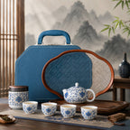 Blue lotus porcelain Gongfu Chinese tea set with teapot, teacups, tea canister, tray, and carrying case in a traditional tea room