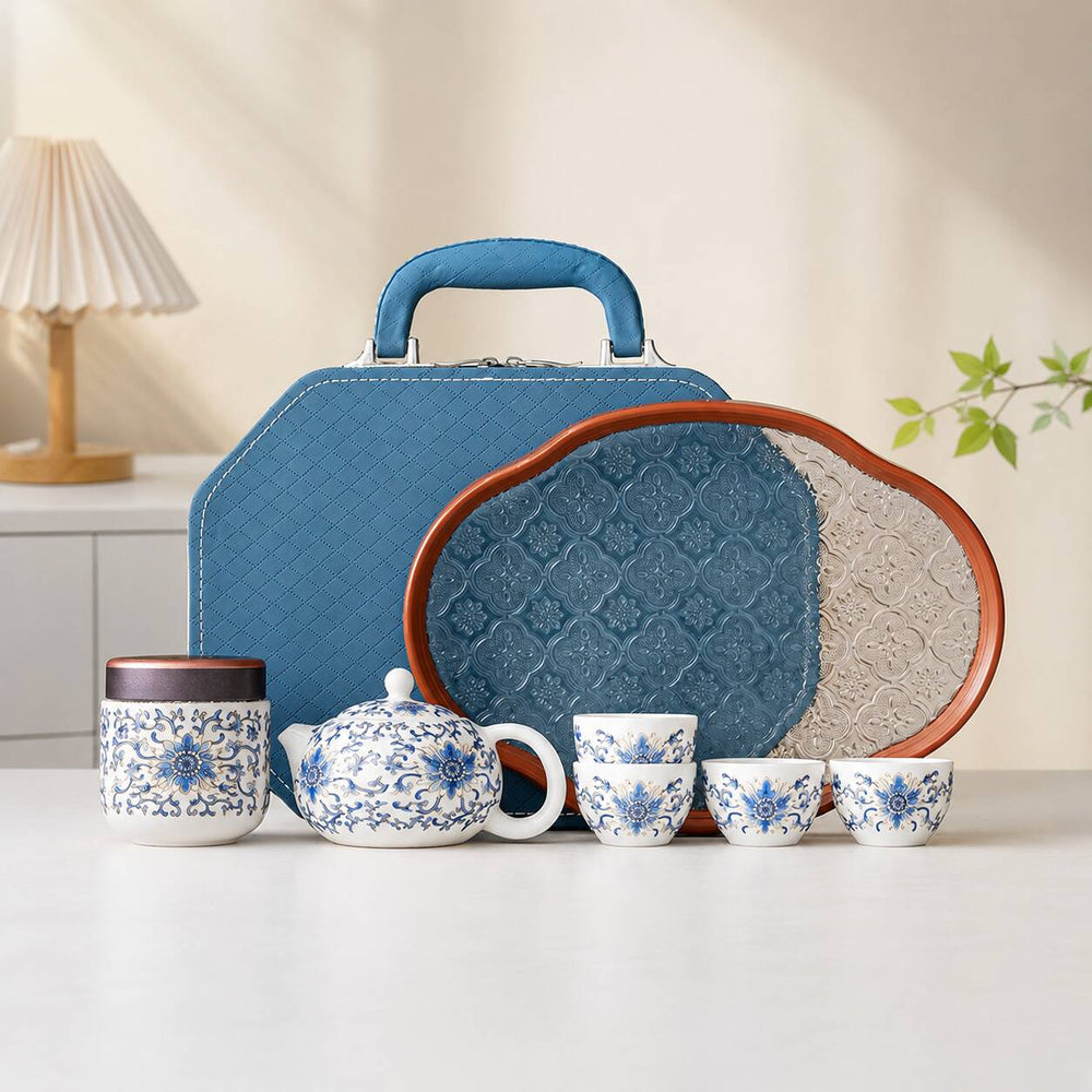 Blue lotus porcelain Gongfu Chinese tea set with teapot, teacups, tea canister, tray, and blue gift bag