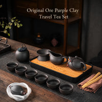 Portable purple clay Gongfu Chinese tea set with teapot, cups, tea caddy, strainer, tea tray, and bamboo tongs